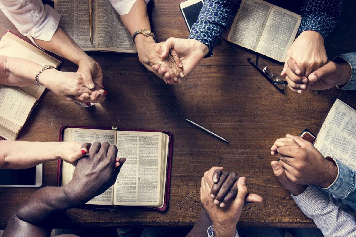 Group of people holding hands